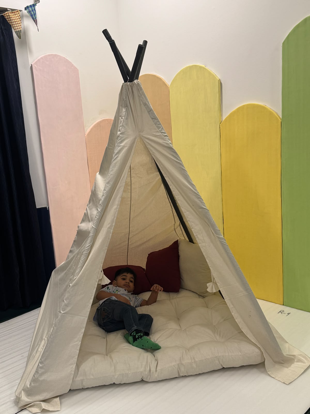 Baby playing in a colorful nursery