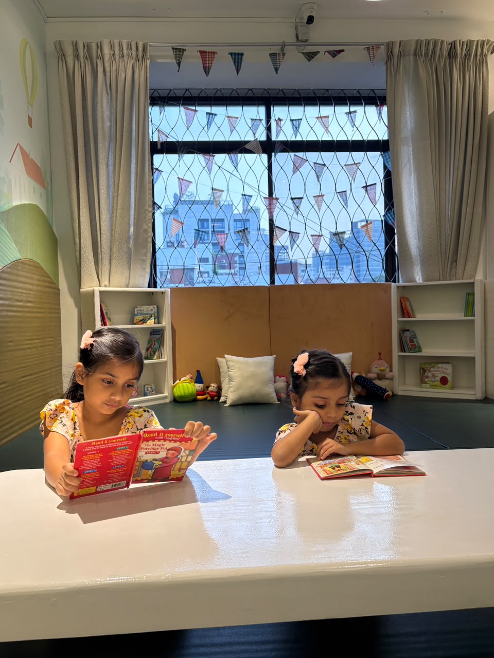 Kids are enjoying a story book.